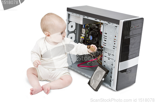 Image of young child working on open computer
