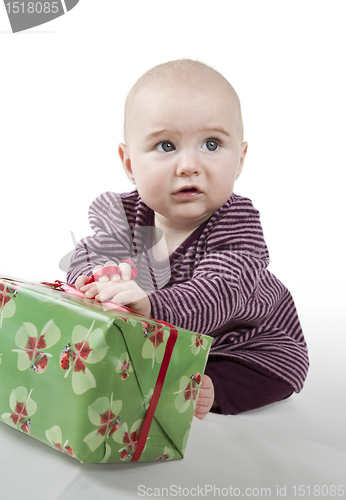 Image of young baby with gift