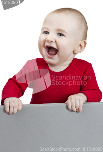 Image of young child holding sign