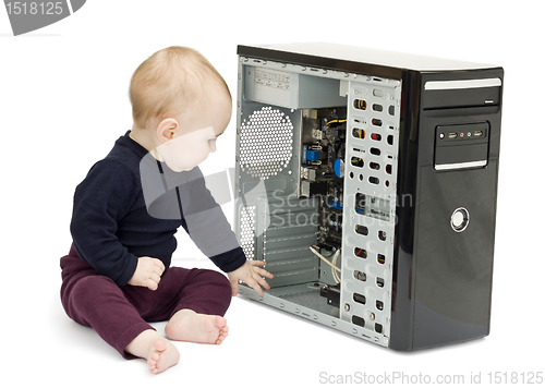 Image of young child with open computer