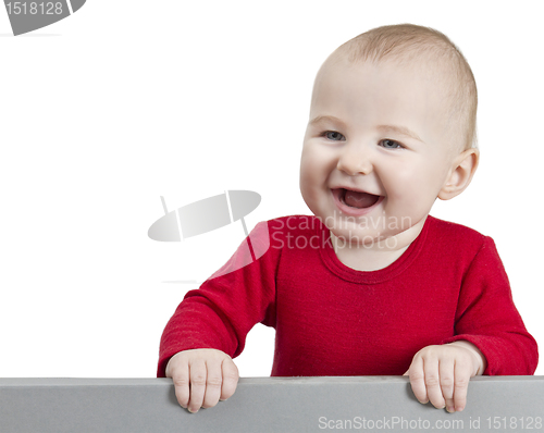 Image of young happy child holding shield