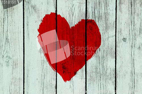 Image of love symbol on old wooden wall