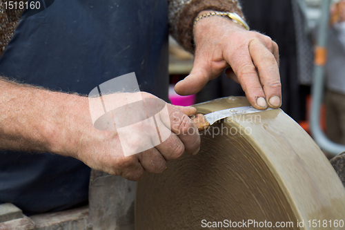 Image of Blade against a grindstone