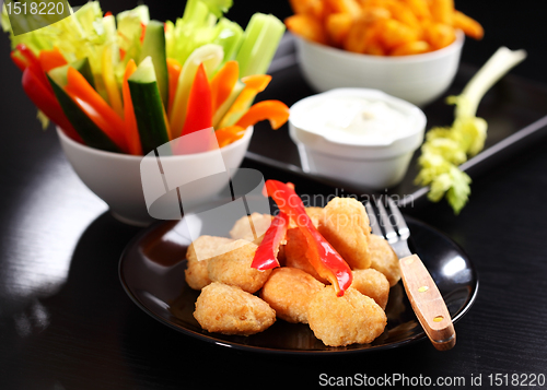 Image of Chili cheese nuggets with raw vegetable