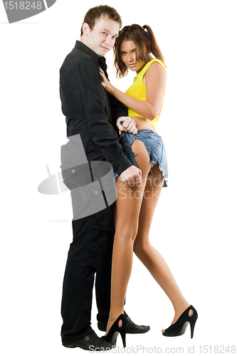 Image of man rending shorts of woman