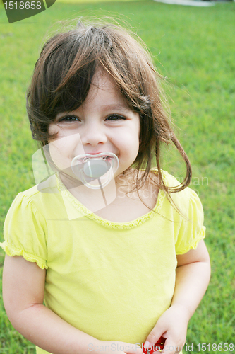 Image of baby girl with pacifier 
