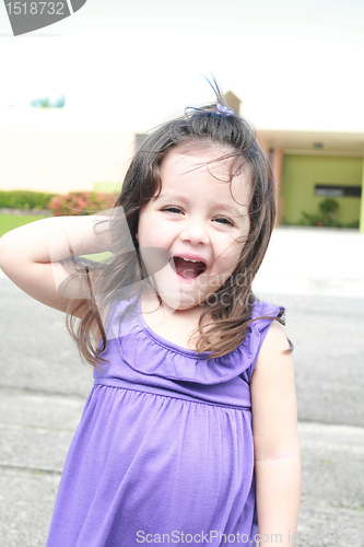 Image of surprised beautiful little girl, summer park in background. 