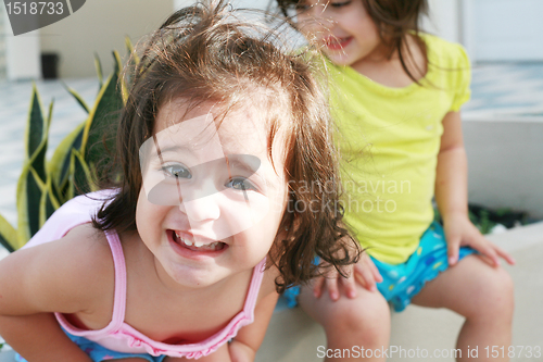 Image of Sweet little girls in front of her little house for playtime (fo