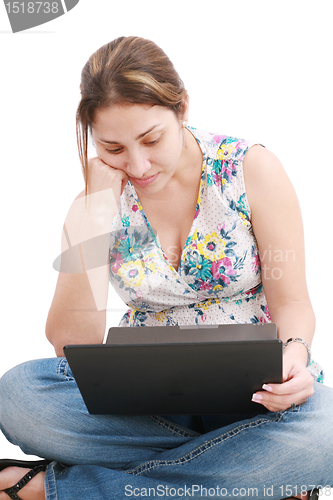 Image of Young girl on the laptop having some problems . 