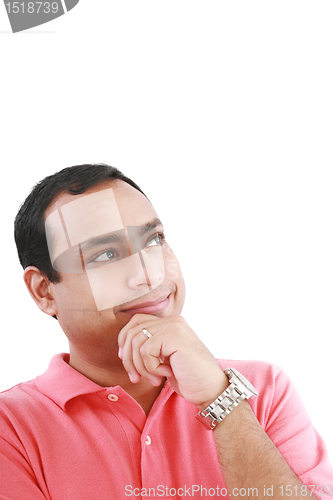 Image of Portrait of a thoughtful young guy standing looking away on whit
