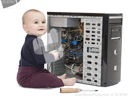 Image of young child with open computer