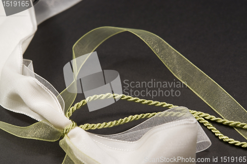 Image of decorative white and green bow