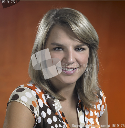 Image of smiling young girl portrait in brown back