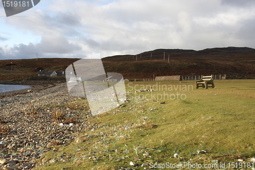 Image of peaceful coastal scenery with bench