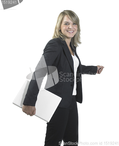 Image of young business woman holding a laptop