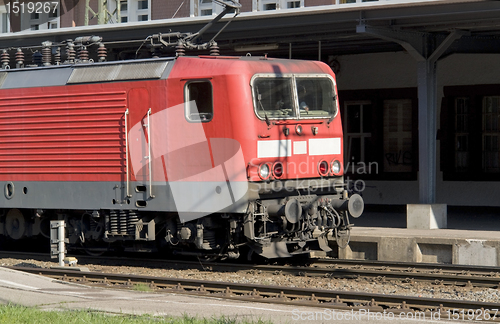 Image of red train in sunny ambiance