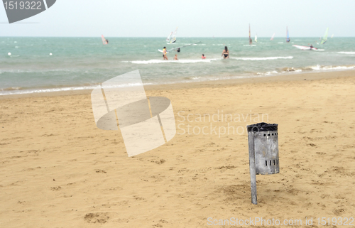 Image of trash can at the sunny beach