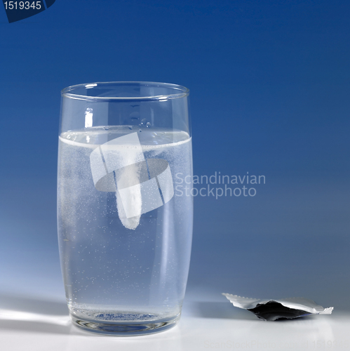 Image of dissolving fizzy tablet in a glass of water