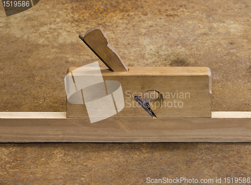 Image of planer on wooden plank