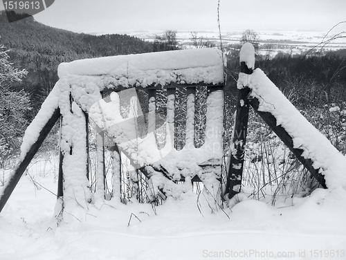 Image of snow covered rustic gate