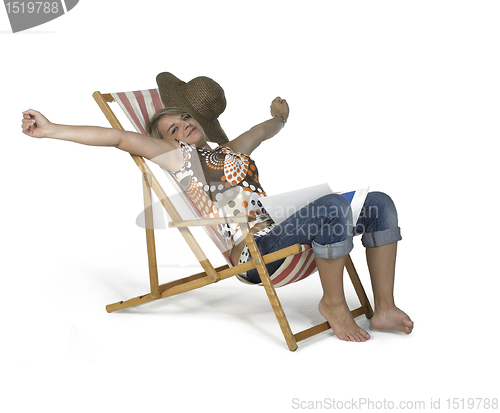 Image of cute girl sprawling in a canvas chair