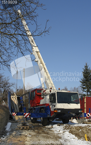 Image of wooden house construction at winter time