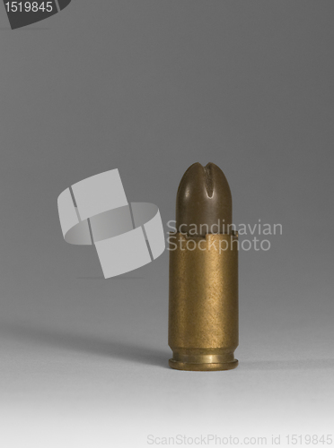 Image of pistol ammunition in grey back
