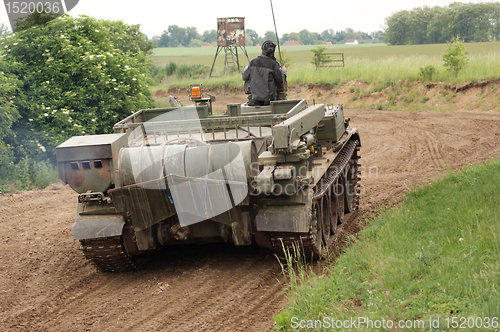 Image of offroad scenery with driving tank