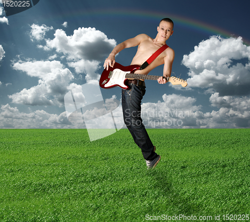 Image of hippie girl with the guitar outdoor