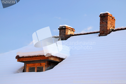 Image of Attic Window and Two Chimneys in Winter