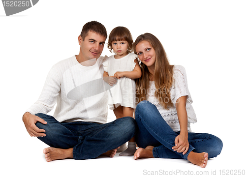 Image of happy family sitting in the studio