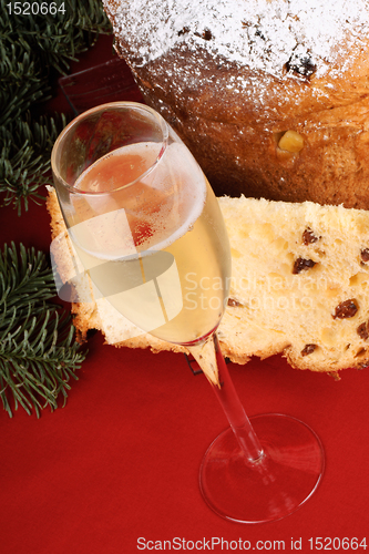 Image of Christmas composition with panettone and spumante