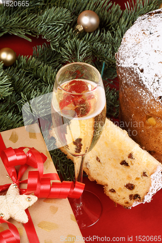 Image of Christmas composition with panettone and spumante