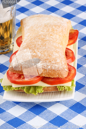 Image of Italian panino sandwich and beer