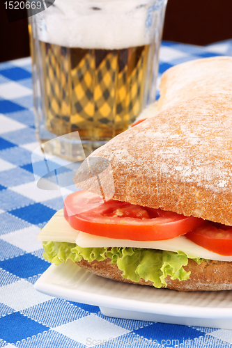 Image of Italian panino sandwich and beer