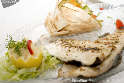 Image of A slice of fish with lemon