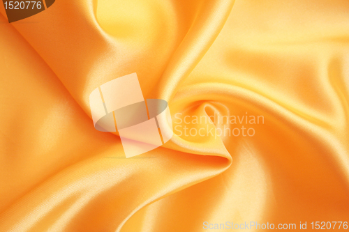 Image of Smooth elegant golden satin as background 