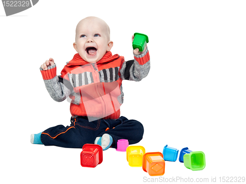 Image of little boy with a plastic pyramid in the studio