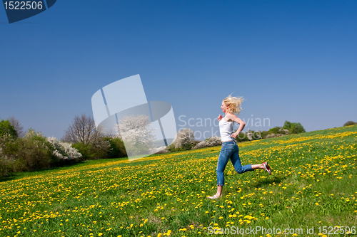 Image of happy young woman on meadow