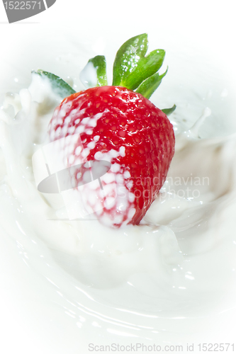 Image of strawberry splashing into milk