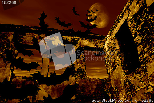 Image of Happy Halloween. Bats are flying over the old ruin. Dramatic toned