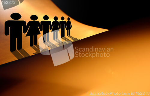 Image of Living on the edge. People silhouettes on the the edge of the paper