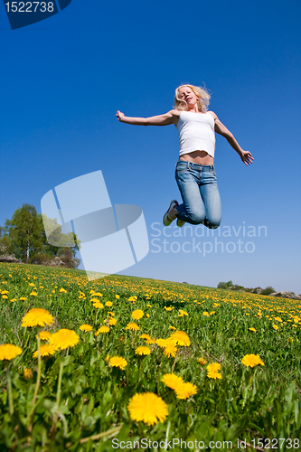 Image of happy young woman on meadow