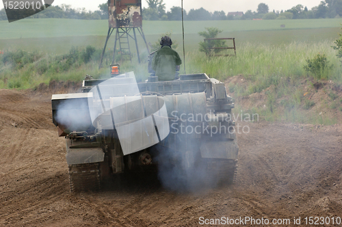 Image of offroad scenery with driving tank