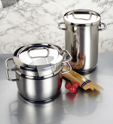 Image of arrangement of stainless steel cookware