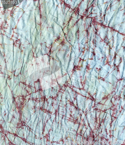 Image of creased fabrics with batik decor