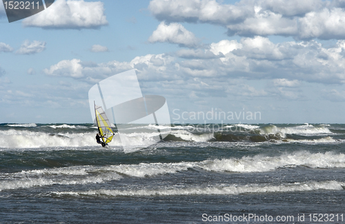 Image of windsurfer in wavy sea