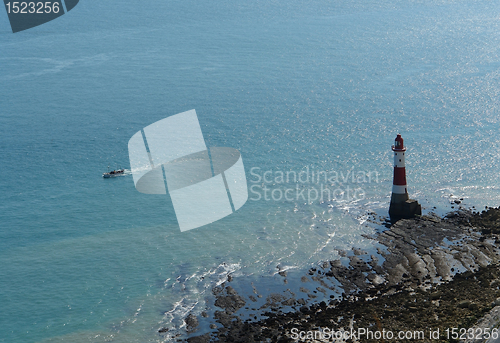 Image of lighthouse and Boat near Beachy Head