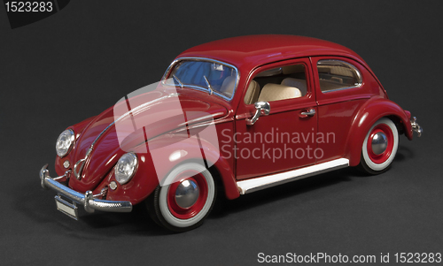 Image of red model car in dark back