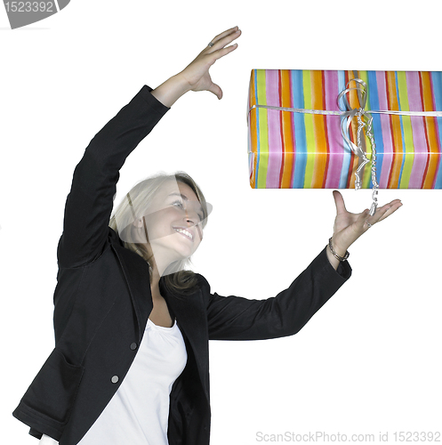 Image of smiling girl is catching a present